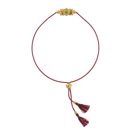Rakhi 1 Turquoise bracelet with red drawstring